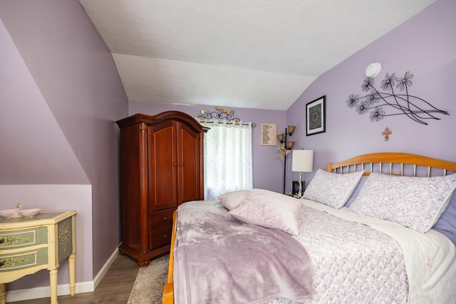 76 Punkintown Rd, Eliot, ME 03903 - bedroom with lofted ceiling and wood finished floors