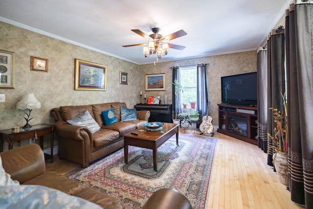 76 Punkintown Rd, Eliot, ME 03903 - living area with wood-type flooring, ceiling fan, ornamental molding, a fireplace, and wallpapered walls
