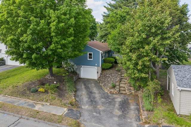 11 Meadow Ln, Portland, ME 04103 - view of front of property with an attached garage and asphalt driveway