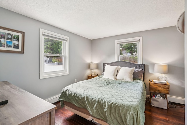 11 Meadow Ln, Portland, ME 04103 - bedroom featuring multiple windows, wood finished floors, baseboards, and a textured ceiling