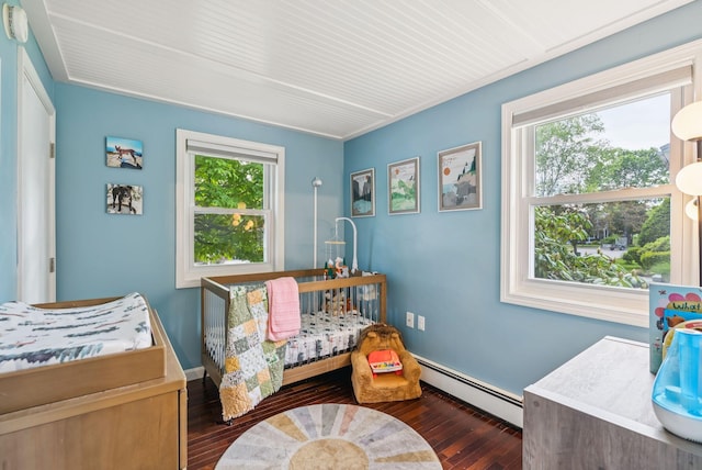 11 Meadow Ln, Portland, ME 04103 - bedroom with a baseboard radiator and dark wood-style flooring