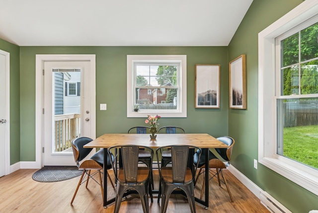 11 Meadow Ln, Portland, ME 04103 - dining area featuring wood finished floors, baseboards, and baseboard heating