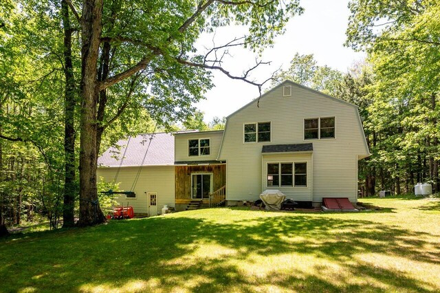 44 Pine Meadow Ct, North Berwick, ME 03906 - back of property with entry steps, a gambrel roof, and a yard