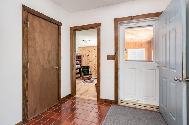 44 Pine Meadow Ct, North Berwick, ME 03906 - entrance foyer featuring baseboards and dark tile patterned flooring