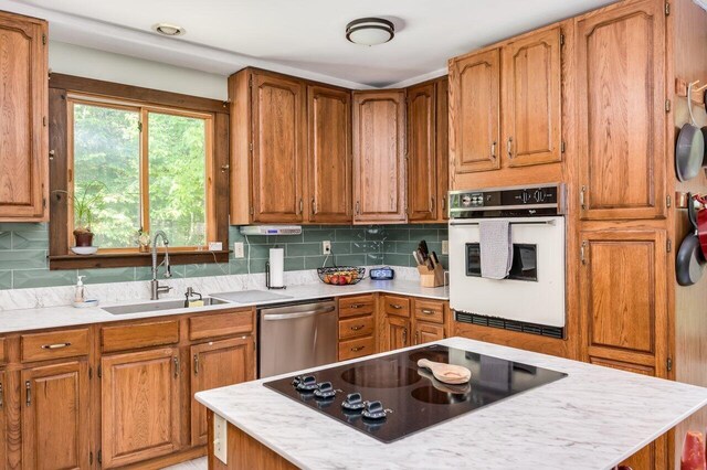 44 Pine Meadow Ct, North Berwick, ME 03906 - kitchen featuring white oven, black electric stovetop, a sink, dishwasher, and light countertops