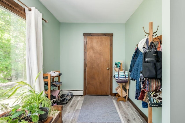 44 Pine Meadow Ct, North Berwick, ME 03906 - doorway with wood finished floors and a baseboard radiator
