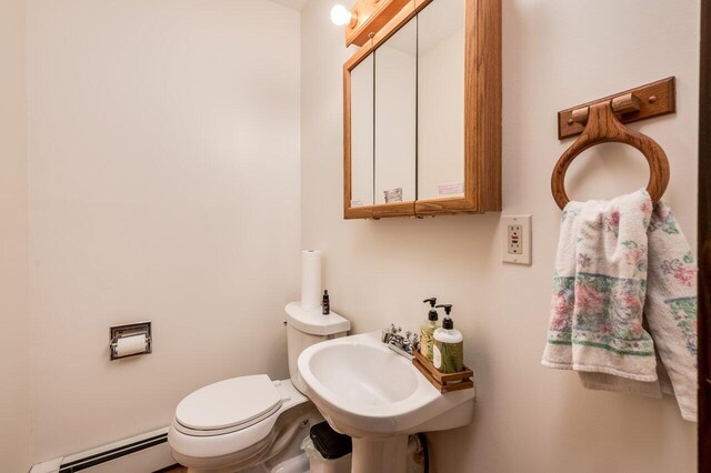 44 Pine Meadow Ct, North Berwick, ME 03906 - bathroom featuring a baseboard heating unit, toilet, and a sink