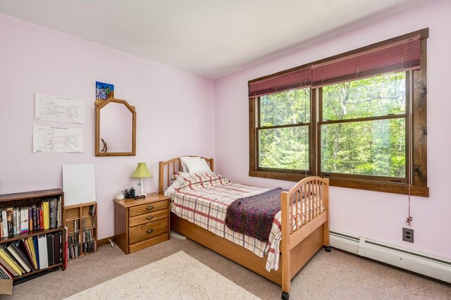 44 Pine Meadow Ct, North Berwick, ME 03906 - bedroom with baseboard heating, light colored carpet, and baseboards