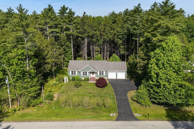 50 Village Green Drive Extension, Ogunquit, ME 03907 - view of front of home with driveway, a wooded view, and a garage