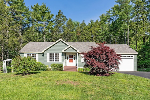 50 Village Green Drive Extension, Ogunquit, ME 03907 - view of front of property featuring roof with shingles, a front yard, a garage, and asphalt driveway