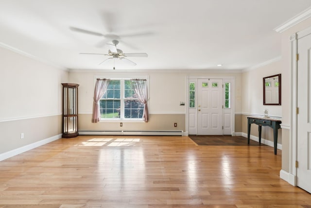 50 Village Green Drive Extension, Ogunquit, ME 03907 - entrance foyer featuring baseboard heating, crown molding, ceiling fan, light wood finished floors, and baseboards