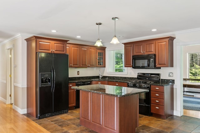 50 Village Green Drive Extension, Ogunquit, ME 03907 - kitchen with black appliances, a sink, ornamental molding, pendant lighting, and dark stone countertops