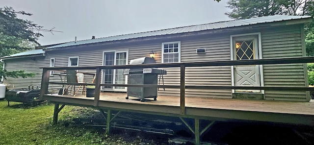 65 Pine Ridge Rd, Cushing, ME 04563 - view of property exterior with a wooden deck and metal roof
