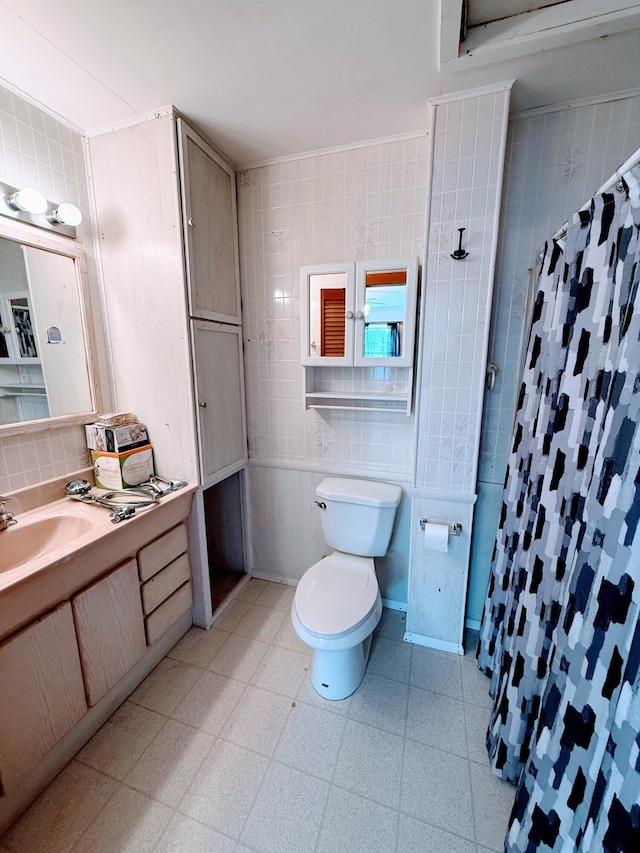 65 Pine Ridge Rd, Cushing, ME 04563 - bathroom with toilet, tile patterned floors, vanity, a shower with curtain, and tile walls