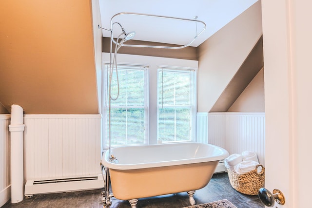 24 High St, Livermore Falls, ME 04254 - bathroom featuring baseboard heating, wainscoting, and a freestanding tub