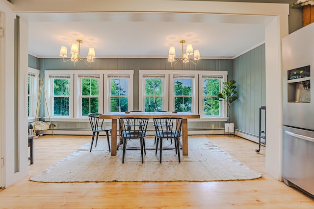 24 High St, Livermore Falls, ME 04254 - dining room featuring a chandelier, crown molding, healthy amount of natural light, and wood finished floors