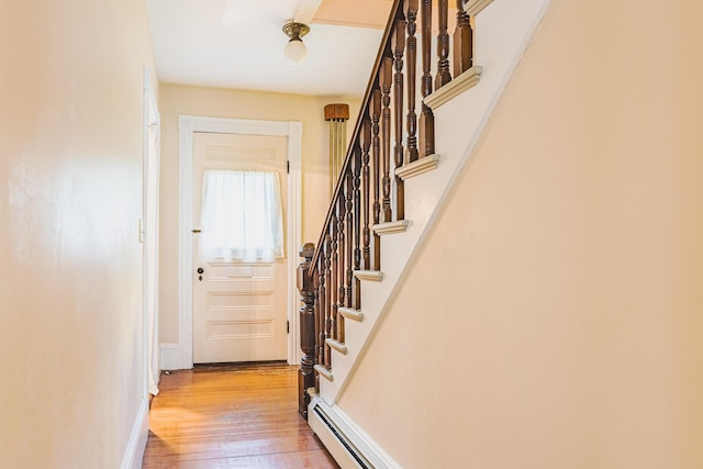 24 High St, Livermore Falls, ME 04254 - doorway to outside featuring light wood-type flooring and stairs