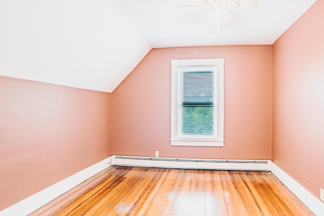 24 High St, Livermore Falls, ME 04254 - bonus room with a baseboard radiator, hardwood / wood-style flooring, vaulted ceiling, and ceiling fan