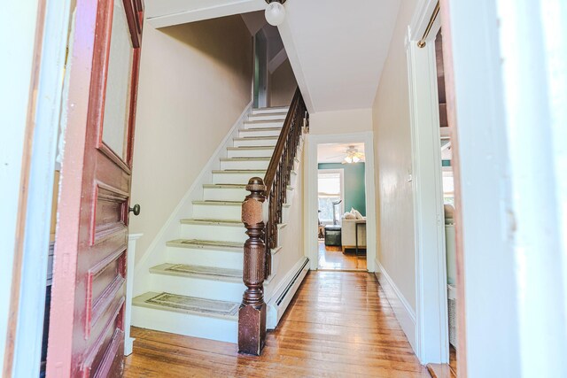 24 High St, Livermore Falls, ME 04254 - foyer with wood-type flooring, stairs, baseboard heating, and a ceiling fan