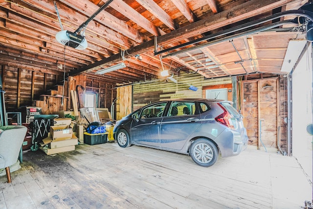 24 High St, Livermore Falls, ME 04254 - garage featuring a garage door opener