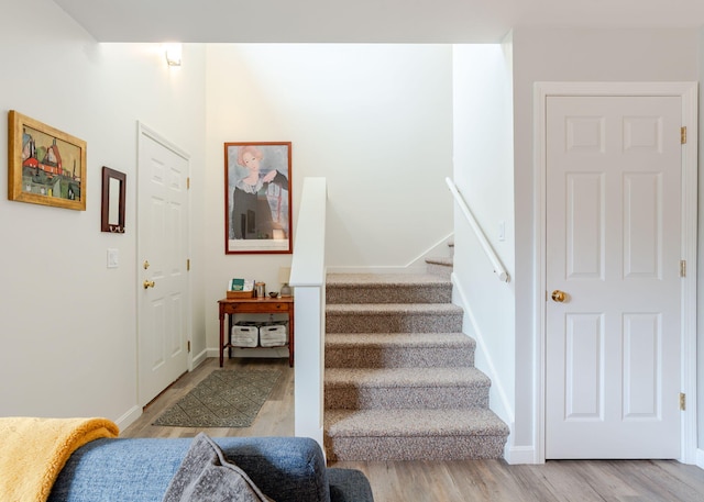 38 Guadalcanal St Unit 38, Brunswick, ME 04011 - stairs featuring wood finished floors and baseboards