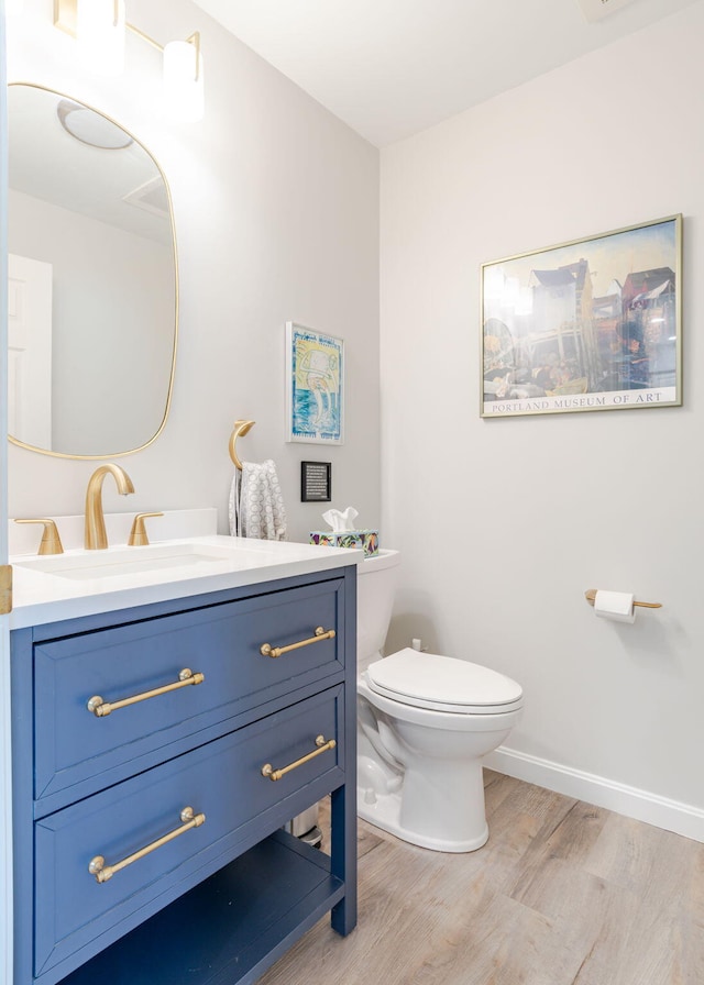 38 Guadalcanal St Unit 38, Brunswick, ME 04011 - half bathroom featuring wood finished floors and vanity
