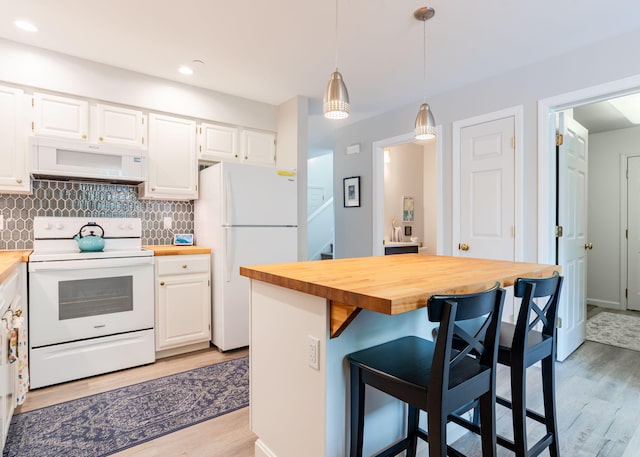 38 Guadalcanal St Unit 38, Brunswick, ME 04011 - kitchen with white appliances, butcher block countertops, ventilation hood, light wood-style floors, and white cabinets