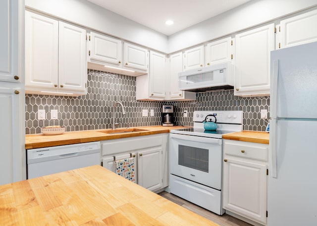 38 Guadalcanal St Unit 38, Brunswick, ME 04011 - kitchen with wood counters, white appliances, and white cabinets