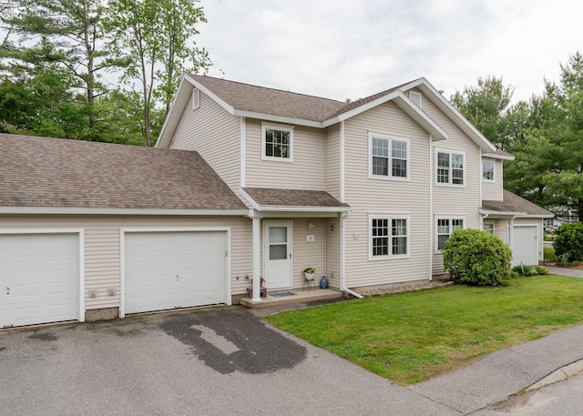 38 Guadalcanal St Unit 38, Brunswick, ME 04011 - traditional-style house featuring asphalt driveway, a front yard, a garage, and roof with shingles