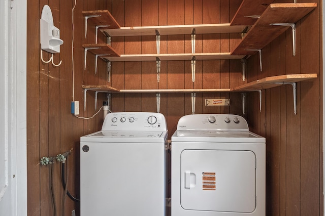 785 W Main St, Waldoboro, ME 04572 - laundry area with wooden walls and washing machine and clothes dryer