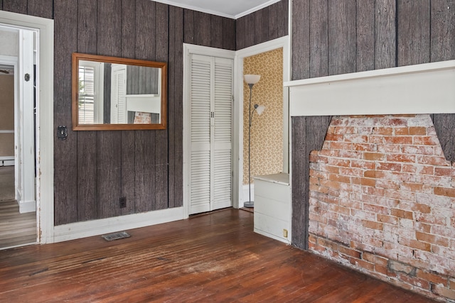 785 W Main St, Waldoboro, ME 04572 - spare room with dark wood finished floors and wooden walls