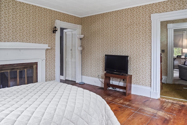 785 W Main St, Waldoboro, ME 04572 - bedroom with ornamental molding, wood finished floors, and a glass covered fireplace