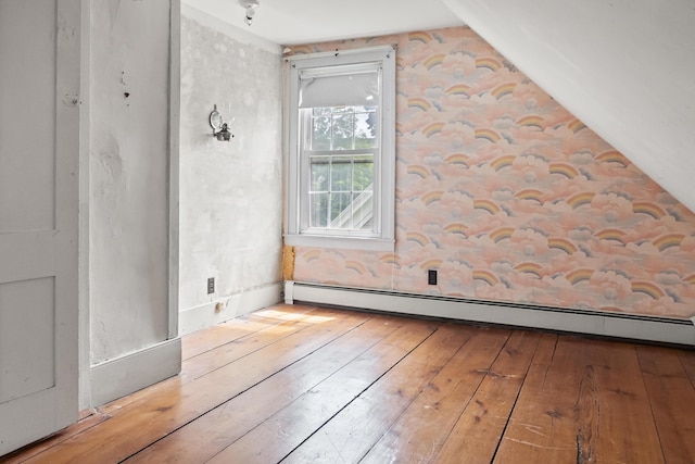 785 W Main St, Waldoboro, ME 04572 - additional living space with baseboard heating, hardwood / wood-style floors, and vaulted ceiling