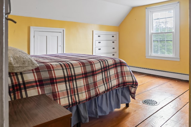 785 W Main St, Waldoboro, ME 04572 - bedroom with a baseboard radiator, vaulted ceiling, and hardwood / wood-style flooring
