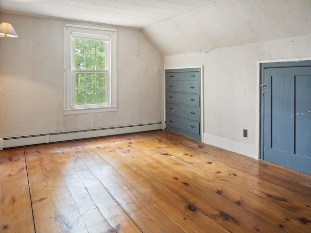 785 W Main St, Waldoboro, ME 04572 - additional living space with a baseboard radiator, vaulted ceiling, and light wood-type flooring