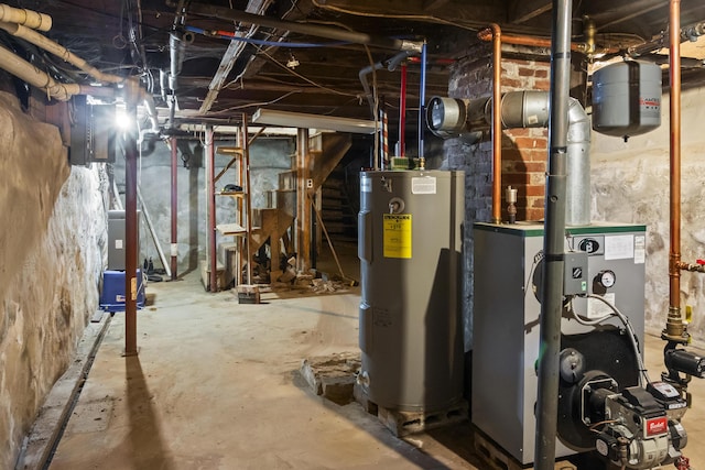 785 W Main St, Waldoboro, ME 04572 - unfinished below grade area featuring electric water heater, stairs, and a heating unit