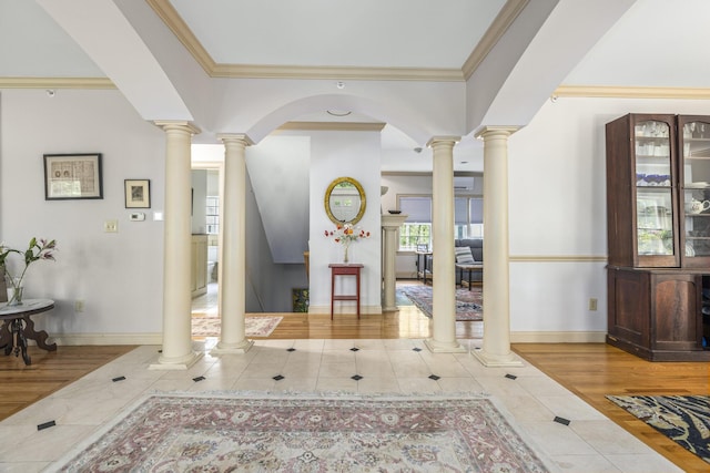 36 Acorn Ln, South Portland, ME 04106 - tiled foyer entrance with inlaid floor details, decorative columns, and ornamental molding