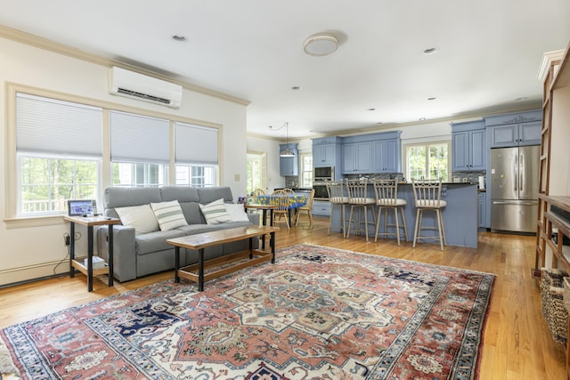 36 Acorn Ln, South Portland, ME 04106 - living area featuring a wall unit AC, crown molding, plenty of natural light, and light wood-style floors