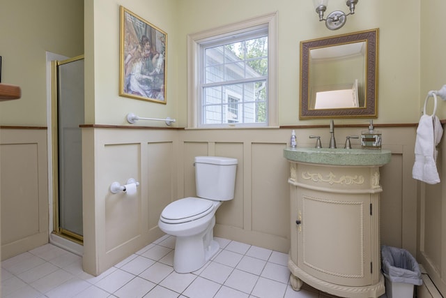 36 Acorn Ln, South Portland, ME 04106 - full bathroom featuring a decorative wall, vanity, a stall shower, a wainscoted wall, and tile patterned floors