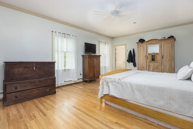 36 Acorn Ln, South Portland, ME 04106 - bedroom with crown molding, light wood-type flooring, baseboard heating, and ceiling fan