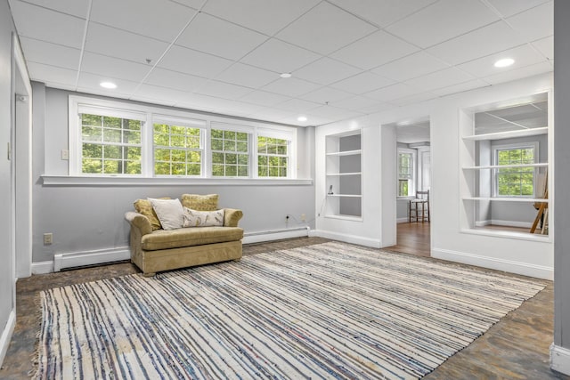 36 Acorn Ln, South Portland, ME 04106 - living area featuring baseboard heating, built in shelves, a baseboard radiator, healthy amount of natural light, and recessed lighting