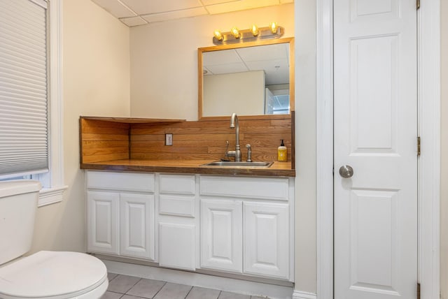 36 Acorn Ln, South Portland, ME 04106 - bathroom with a paneled ceiling, vanity, and tile patterned floors
