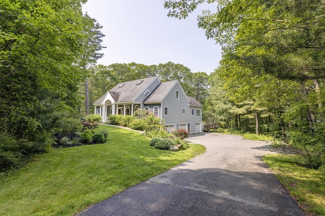 36 Acorn Ln, South Portland, ME 04106 - view of front facade with a garage, driveway, and a front lawn