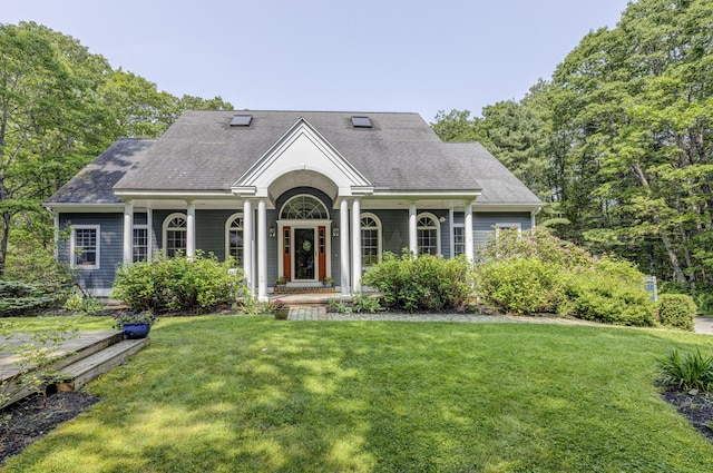 36 Acorn Ln, South Portland, ME 04106 - view of front of house with a front lawn, a porch, and roof with shingles