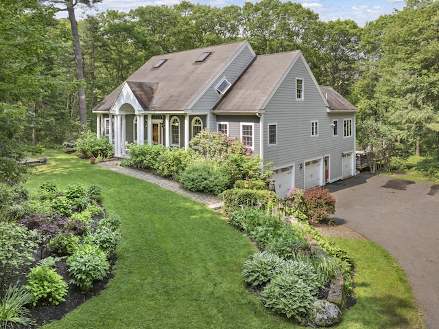 36 Acorn Ln, South Portland, ME 04106 - view of front of home featuring a garage, asphalt driveway, a front yard, and a shingled roof