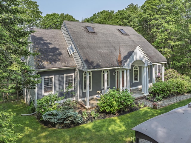 36 Acorn Ln, South Portland, ME 04106 - view of front facade featuring a porch and a front lawn