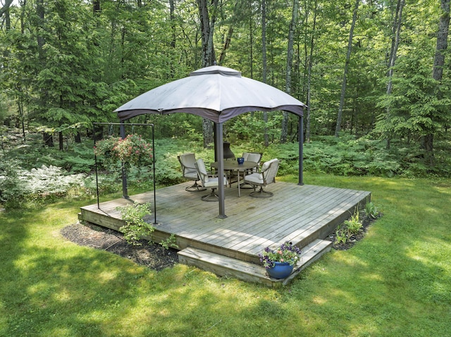 36 Acorn Ln, South Portland, ME 04106 - wooden terrace with a forest view, a lawn, and outdoor dining area