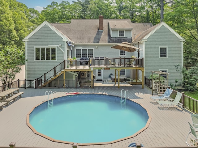 36 Acorn Ln, South Portland, ME 04106 - outdoor pool with a deck, stairway, and view of scattered trees