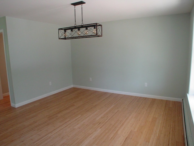 29 Deer Pond Ln, Bangor, ME 04401 - unfurnished room with light wood finished floors, baseboards, and a baseboard heating unit