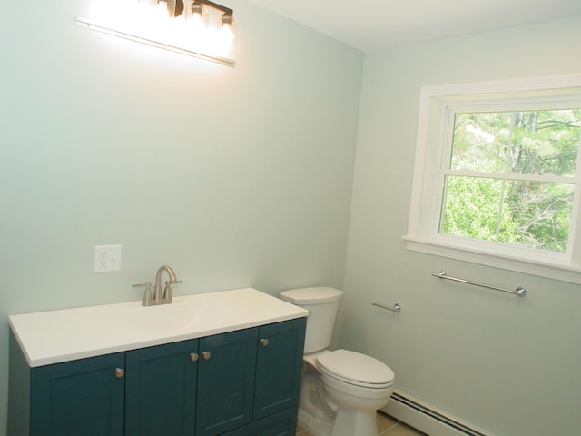 29 Deer Pond Ln, Bangor, ME 04401 - half bathroom featuring a baseboard heating unit, toilet, vanity, and tile patterned flooring